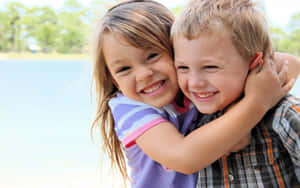 Cute Baby Couple Excited Hug Wallpaper