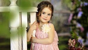 Cute Baby Girl In A Pink Dress Wallpaper