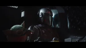 Cute Baby Yoda With Mandalorian Wallpaper