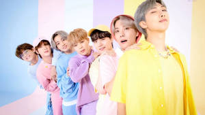 Cute Bts Group Lined Up In Pastel Colors Wallpaper