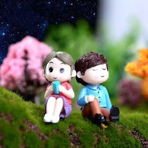 Cute Doll Couple In The Garden Wallpaper