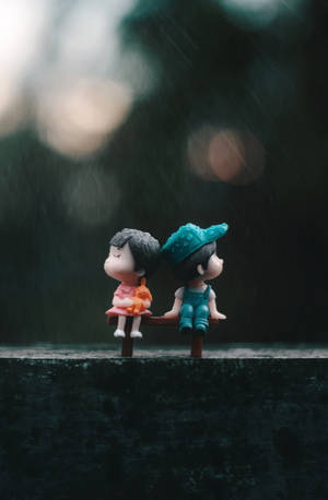 Cute Doll Couple In The Rain Wallpaper
