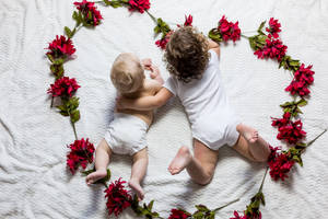 Cute Flower Heart With Babies Wallpaper