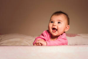 Cute Fun Baby In Pink Wallpaper