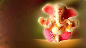 Cute Ganesha Glowing In Yellow Wallpaper