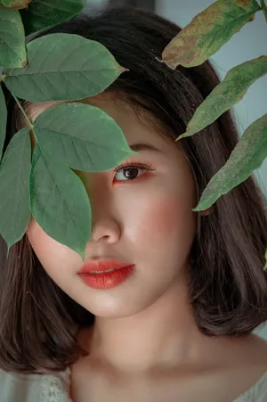 Cute Girl With Creative Plant Aesthetic Portrait Wallpaper