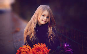 Cute Girl With Orange Flower Wallpaper
