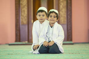 Cute Kneeling Islamic Boys Wallpaper