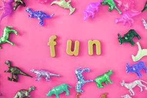 Cute Pink Dinosaur Fun Toys Wallpaper