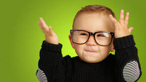 Cute Smile Baby With Glasses Wallpaper