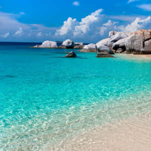 Cute Summer Beach With Large Rocks Wallpaper