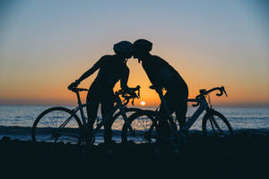 Cycling Couple Silhouette Sunset Wallpaper