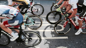 Cycling Race On City Street Wallpaper