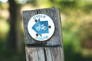 Cycling Route Sign On Wood Wallpaper