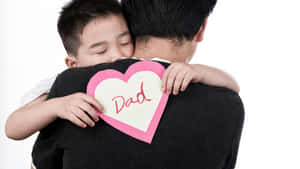 Daddy And Baby Hugging Wallpaper