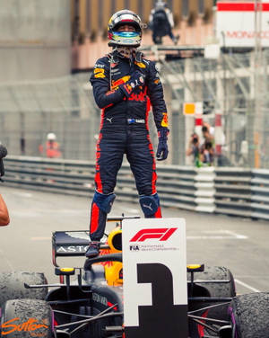 Daniel Ricciardo Standing On Formula One Car Wallpaper