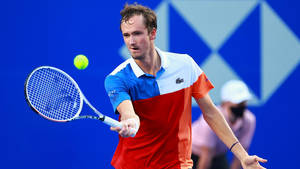 Daniil Medvedev In Action - Determined To Hit The Ball Wallpaper