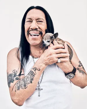 Danny Trejo With Chihuahua Puppy Wallpaper