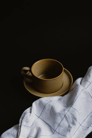 Dark Aesthetic Brown Mug With Kitchen Towel Wallpaper