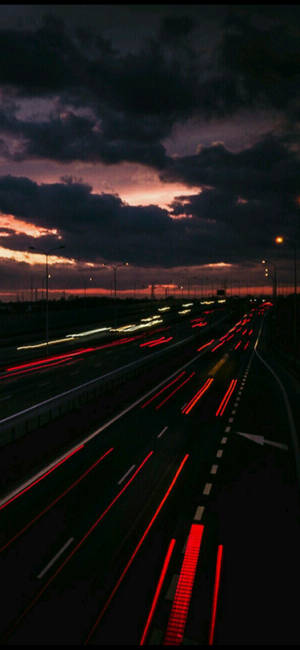 Dark Night And Bustling Highway Wallpaper