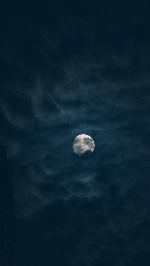 Dark Night Moon Covered In Clouds Wallpaper