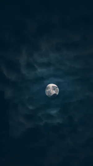 Dark Night Moon Covered In Clouds Wallpaper