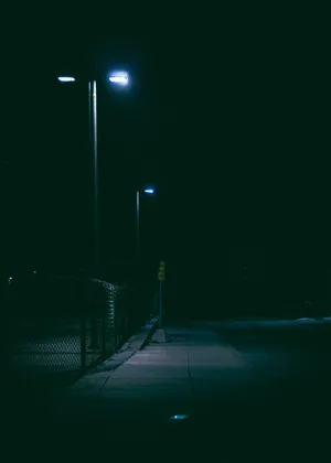 Dark Night Sidewalk With Light Wallpaper