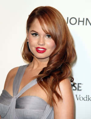 Debby Ryan Radiates Joy In A Colorful Ensemble Wallpaper