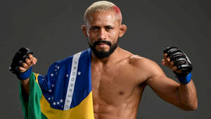 Deiveson Figueiredo Posing With Brazilian Flag Wallpaper