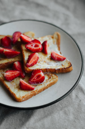 Delectable French Toast With Fresh Berries And Maple Syrup Wallpaper