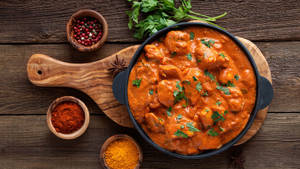 Delicious Butter Chicken Served In An Iron Pan Wallpaper