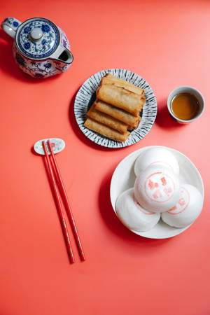 Delicious Egg Roll Paired With Sweet Buns Wallpaper