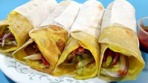 Delicious Egg Rolls Wrapped To Perfection Wallpaper