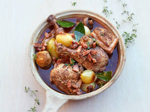 Delicious French Classic, Coq Au Vin In A Pan Wallpaper