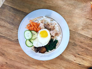 Delightful And Hearty Bibimbap With Fresh Vegetables Wallpaper