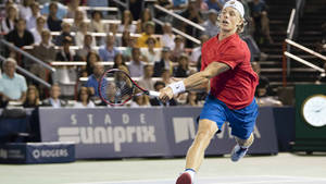 Denis Shapovalov Running In Tennis Court Wallpaper