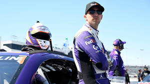 Denny Hamlin Leaning Against Car Wallpaper