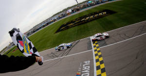 Denny Hamlin Passing The Finish Line Wallpaper