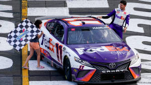 Denny Hamlin Posing With A Young Fan Wallpaper