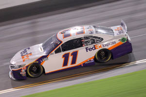 Denny Hamlin Speeding Down The Track Wallpaper