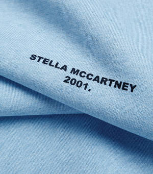 Designer Fabric With Stella Mccartney Logo Wallpaper