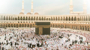 Devout Muslims Gathered Around The Sacred Kaaba Wallpaper