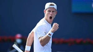 Diego Schwartzman Celebrates His Victory On The Tennis Court Wallpaper