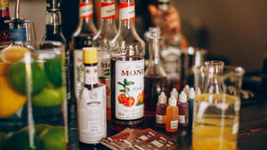 Different Flavored Alcohol Bottles Wallpaper