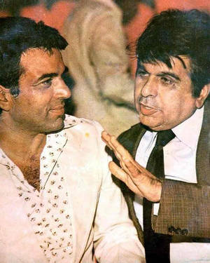 Dilip Kumar And Dharmendra Posed For A Classic Bollywood Photograph Wallpaper