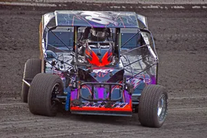 Dirt Car With Red And Violet Decals Wallpaper