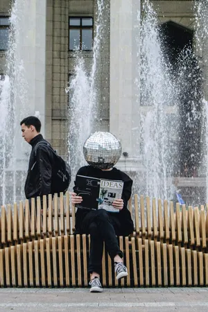 Disco Ball Head Readingby Fountain Wallpaper