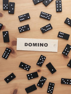 Dominos Scattered On Table Wallpaper