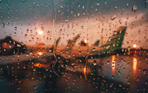 Downtown View Of A City Street In The Rain Wallpaper