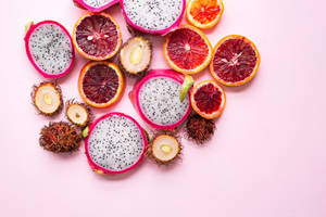 Dragonfruit Blood Orange Rambutan Fruit Slices Wallpaper